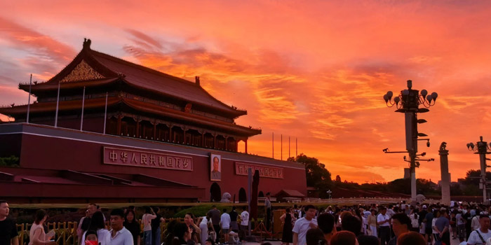 Tiananmen Square at sunrise with quiet plaza and soft morning light