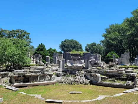 Ruins of the Great Fountain at Yuanmingyuan's Western-Style Buildings, with scattered stone columns against blue sky